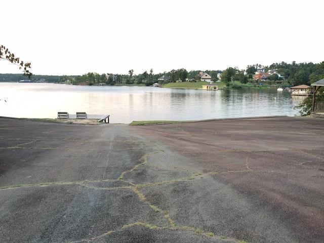 6445 Stapleton Road Macon, GA 31206 - Photo 20 of 22 a view of a lake with houses in the background