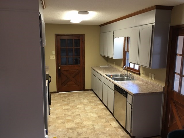 6445 Stapleton Road Macon, GA 31206 - Photo 4 of 22 a bathroom with a granite countertop sink and a mirror