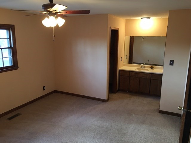 6445 Stapleton Road Macon, GA 31206 - Photo 9 of 22 a view of an empty room with window and bathroom