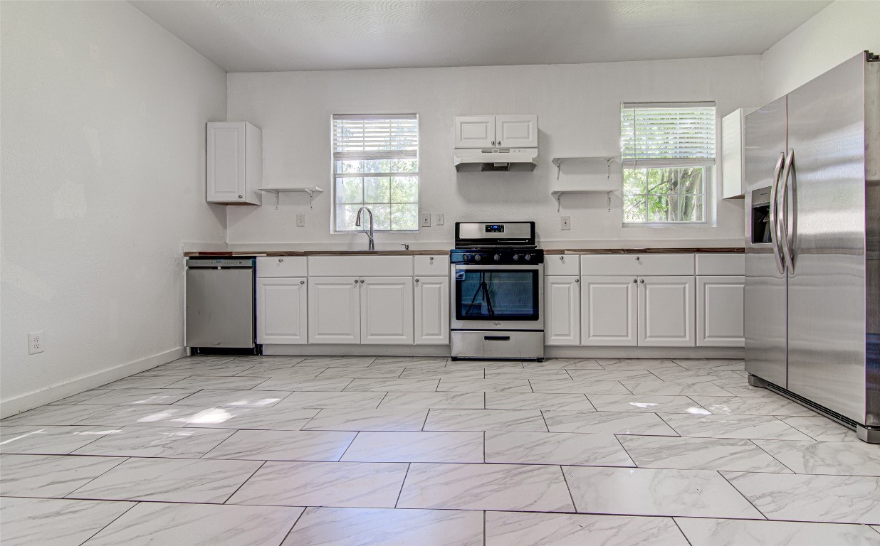 Eat in Kitchen with new dishwasher, Single Basin sink and wood countertop