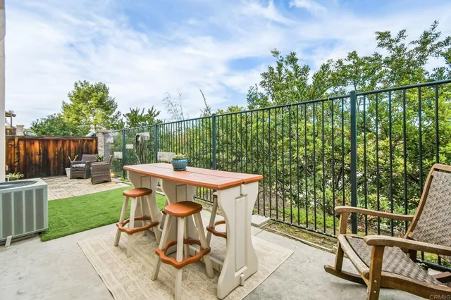 a view of a chairs and table in the patio