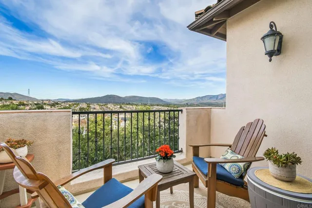 a view of a balcony with furniture