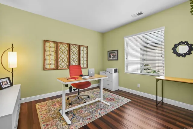 a workspace with furniture and a window