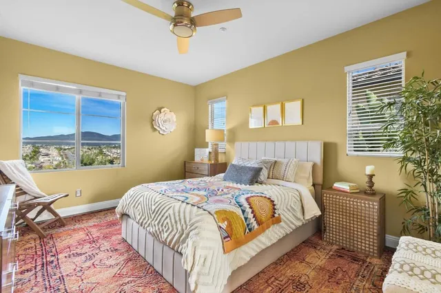 a bedroom with a bed and window