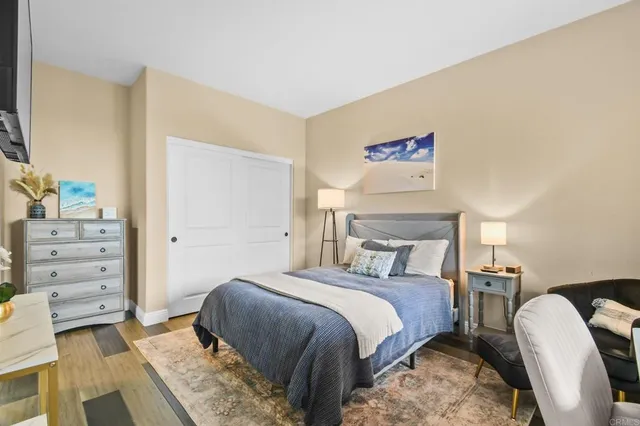 a bedroom with a bed and furniture