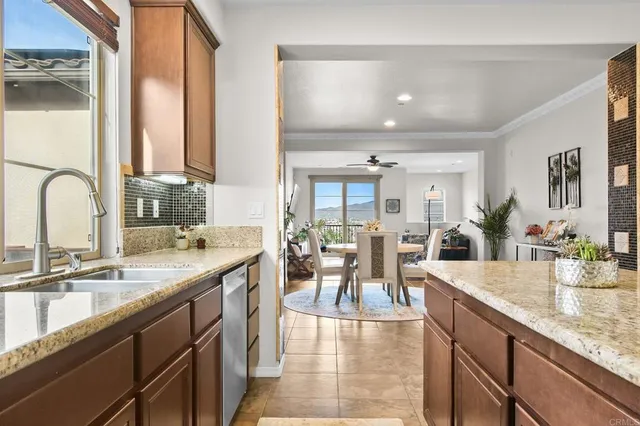 a large kitchen with kitchen island a sink appliances and a counter top space