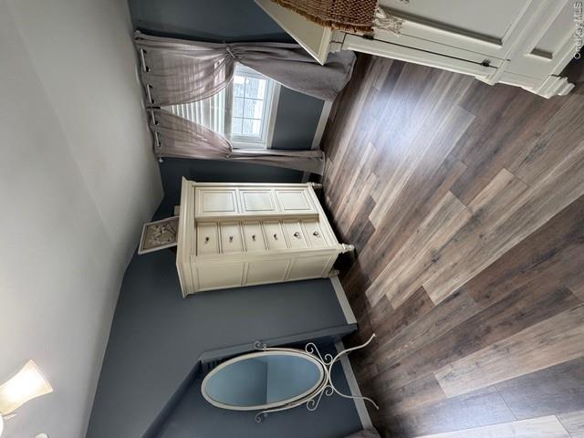 82 Westcott Street Inwood, NY 11096 - Photo 11 of 24 an empty room with wooden floor and windows