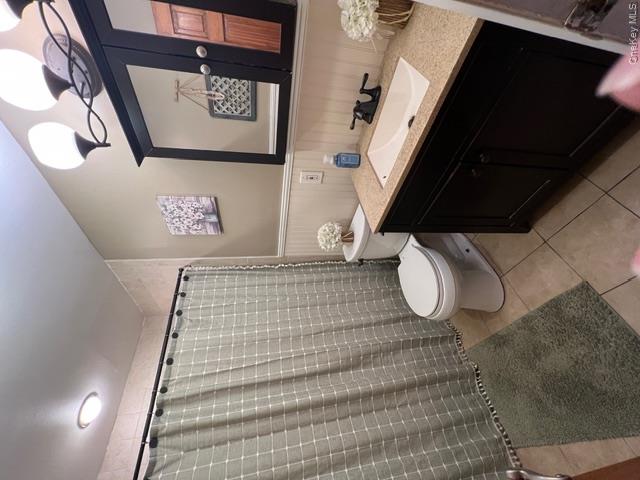 82 Westcott Street Inwood, NY 11096 - Photo 13 of 24 a bathroom with a toilet sink and mirror