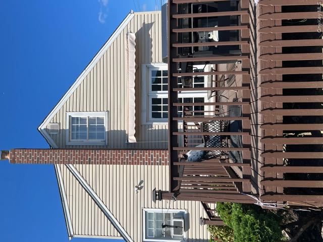 82 Westcott Street Inwood, NY 11096 - Photo 21 of 24 a front view of a house with glass windows