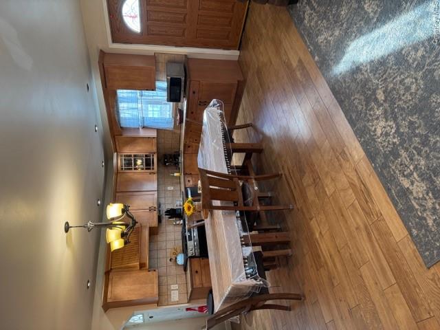 82 Westcott Street Inwood, NY 11096 - Photo 5 of 24 a large kitchen with a table and chairs