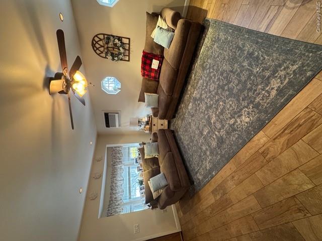 82 Westcott Street Inwood, NY 11096 - Photo 6 of 24 a living room with furniture and a chandelier