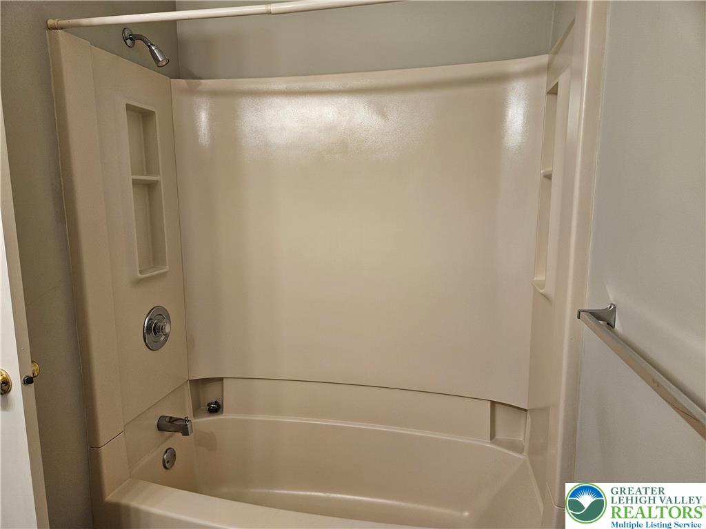 1876 Mansfield Street Hellertown, PA 18055 - Photo 13 of 19 a bathroom with a bathtub and a shower