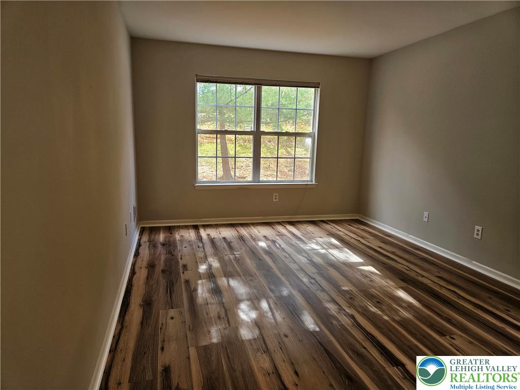 1876 Mansfield Street Hellertown, PA 18055 - Photo 15 of 19 a view of an empty room with wooden floor and a window