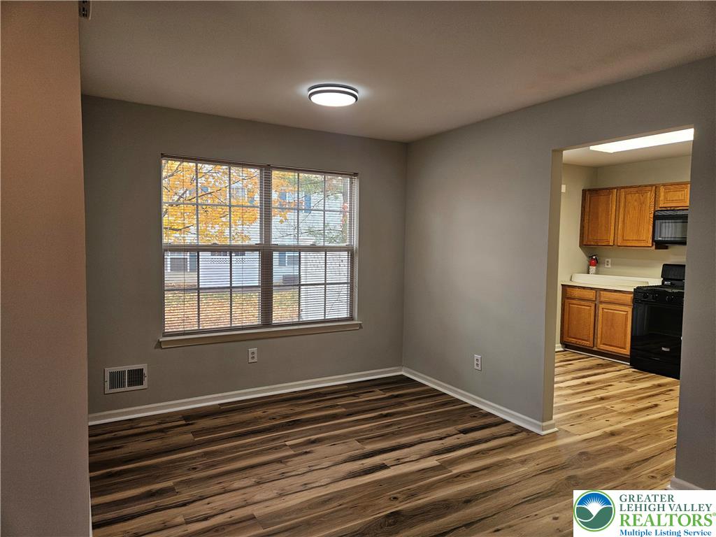1876 Mansfield Street Hellertown, PA 18055 - Photo 4 of 19 a view of a kitchen with wooden floor and a sink