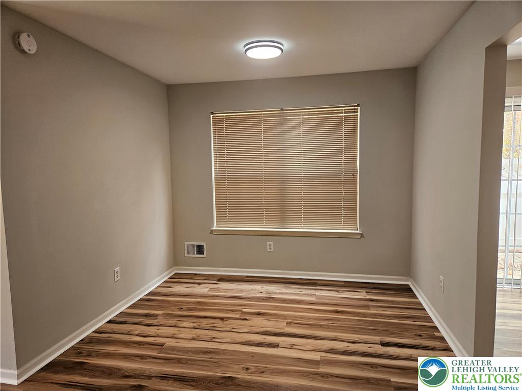 1876 Mansfield Street Hellertown, PA 18055 - Photo 5 of 19 a view of an empty room with wooden floor and a window