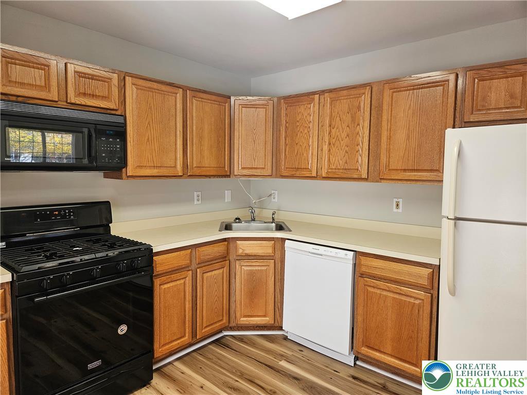 1876 Mansfield Street Hellertown, PA 18055 - Photo 7 of 19 a kitchen with a sink stove and refrigerator