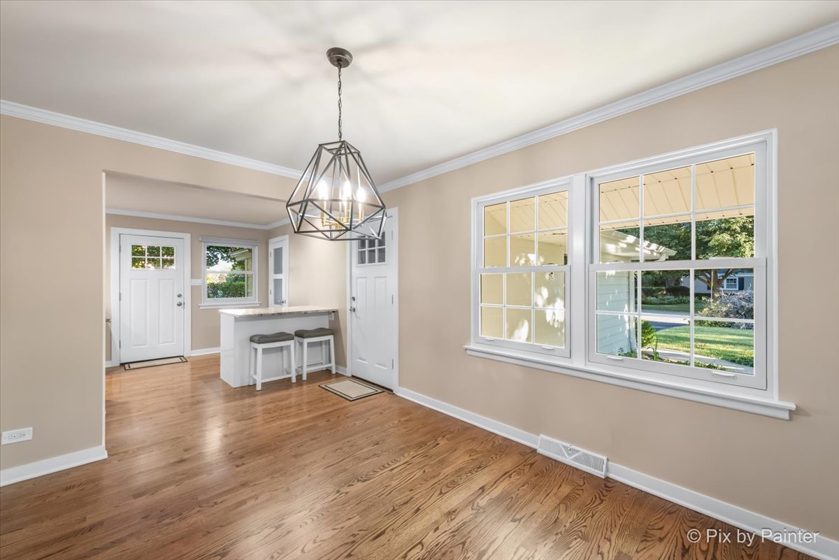 838 East Harriet Lane Barrington, IL 60010 - Photo 9 of 33 a view of a dining room with furniture window and wooden floor