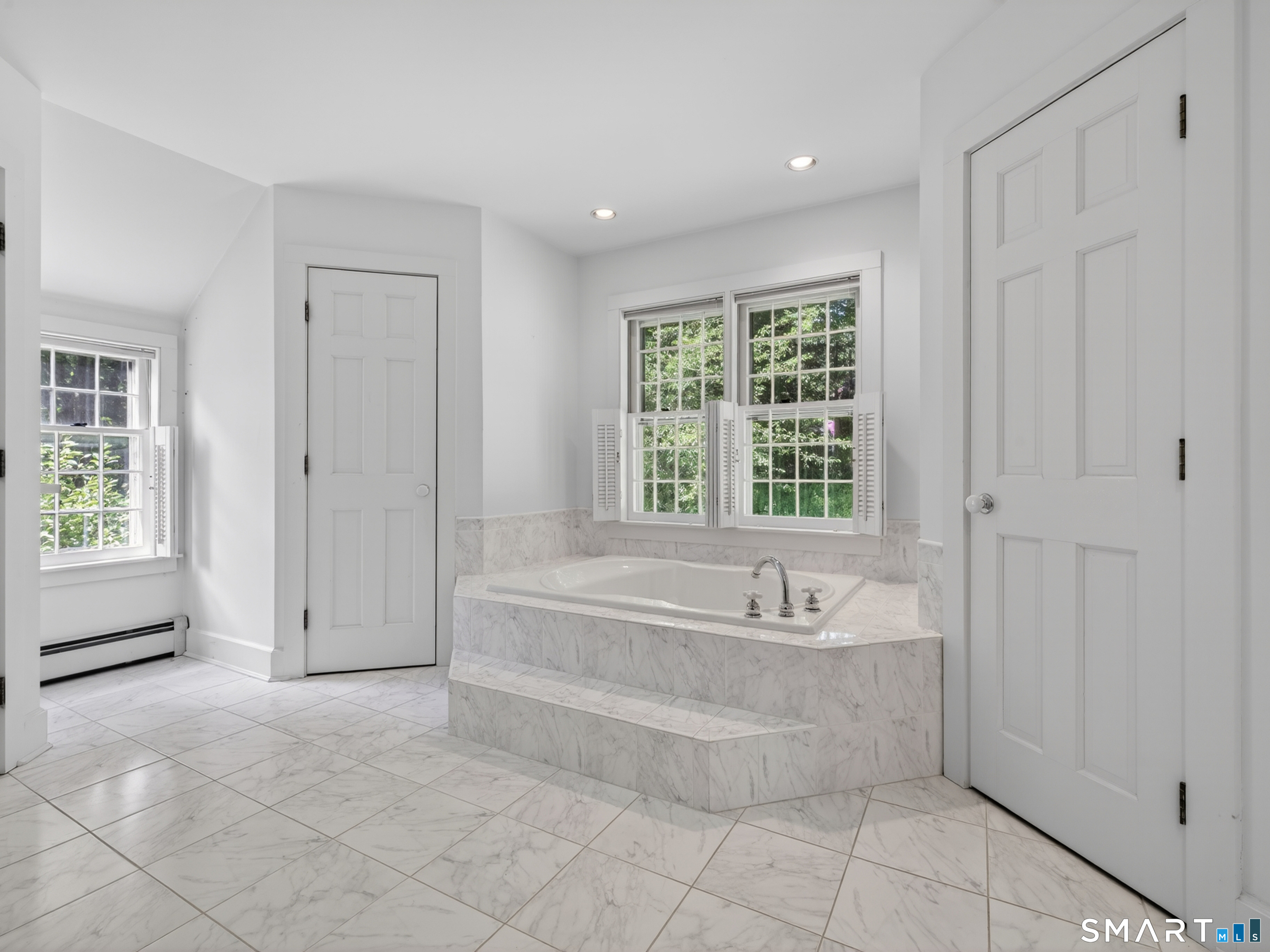 14 Cow Pen Hill Road Killingworth, CT 06419 - Photo 34 of 40 The updated primary ensuite bathroom offers a fresh, modern feel while complementing the classic character of the home.