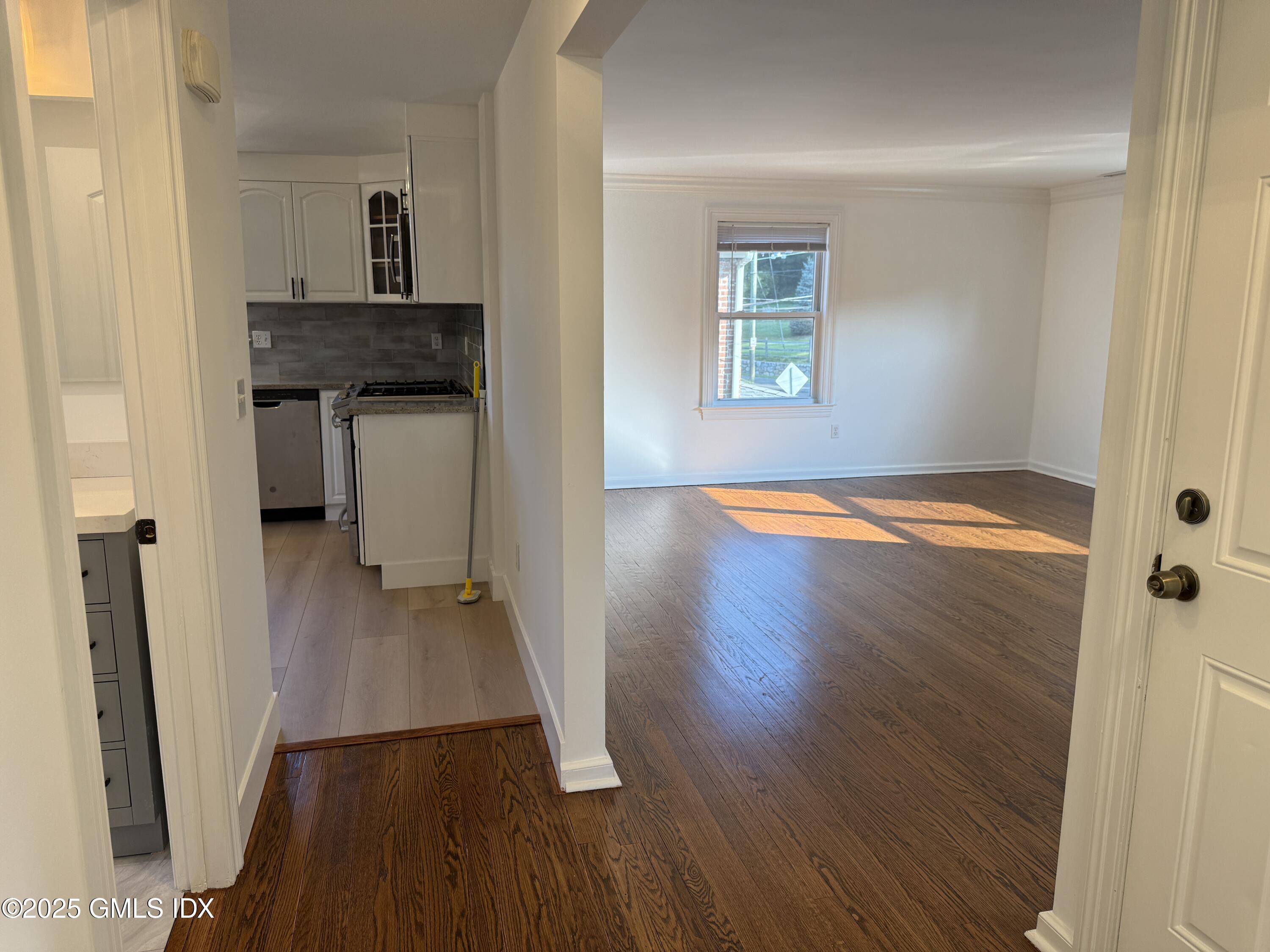 122 Pemberwick Road, Unit 2 Greenwich, CT 06831 - Photo 12 of 17 a view of a hallway view with wooden floor and staircase
