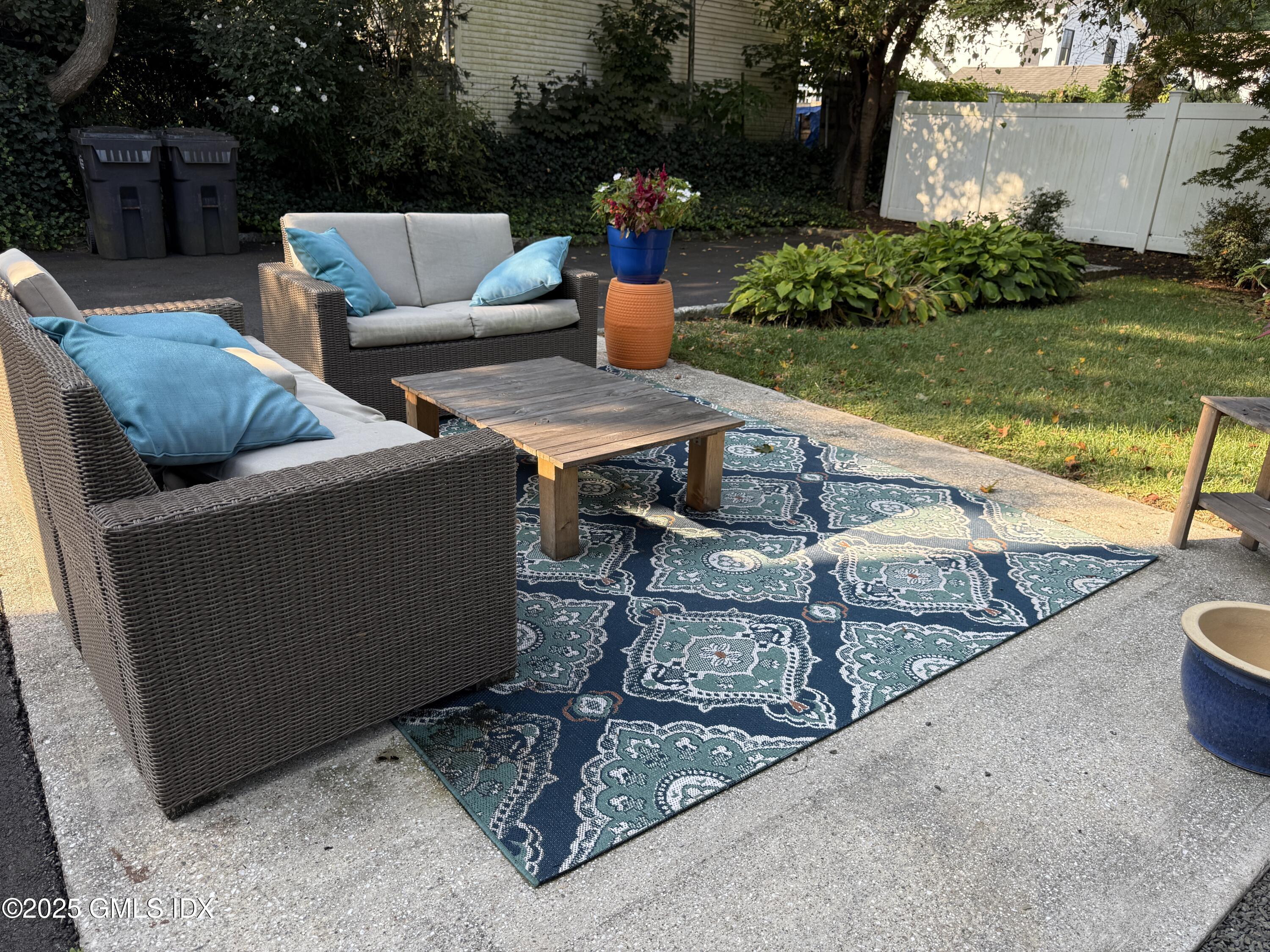 122 Pemberwick Road, Unit 2 Greenwich, CT 06831 - Photo 17 of 17 a view of outdoor sitting area with furniture and garden