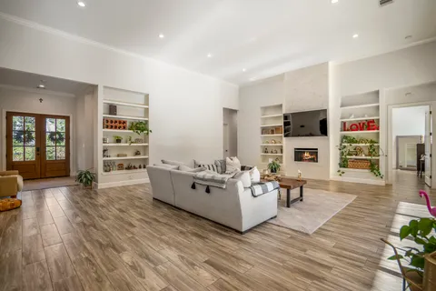 a living room with furniture and a fireplace
