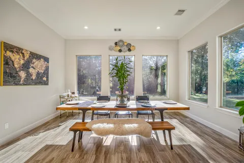a view of a dining room with furniture window and outside view