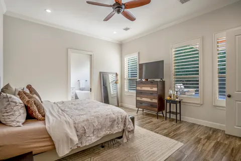 a bedroom with a bed and a television