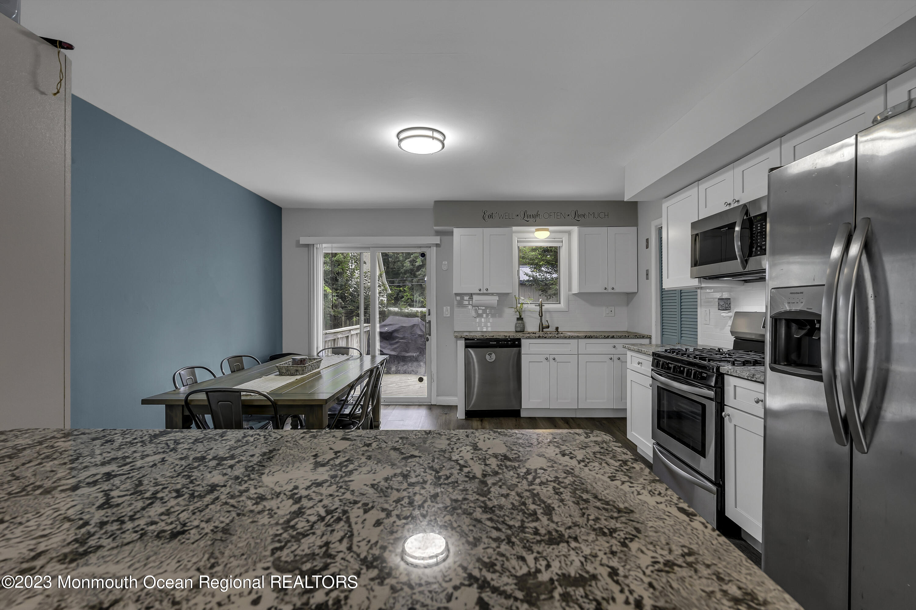 50 Central Avenue Waretown, NJ 08758 - Photo 13 of 35 a kitchen with granite countertop a sink stainless steel appliances and cabinets