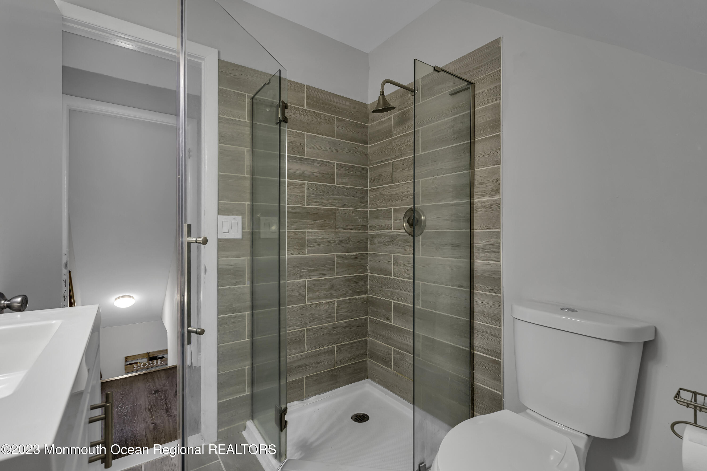 50 Central Avenue Waretown, NJ 08758 - Photo 26 of 35 a bathroom with a shower toilet and sink