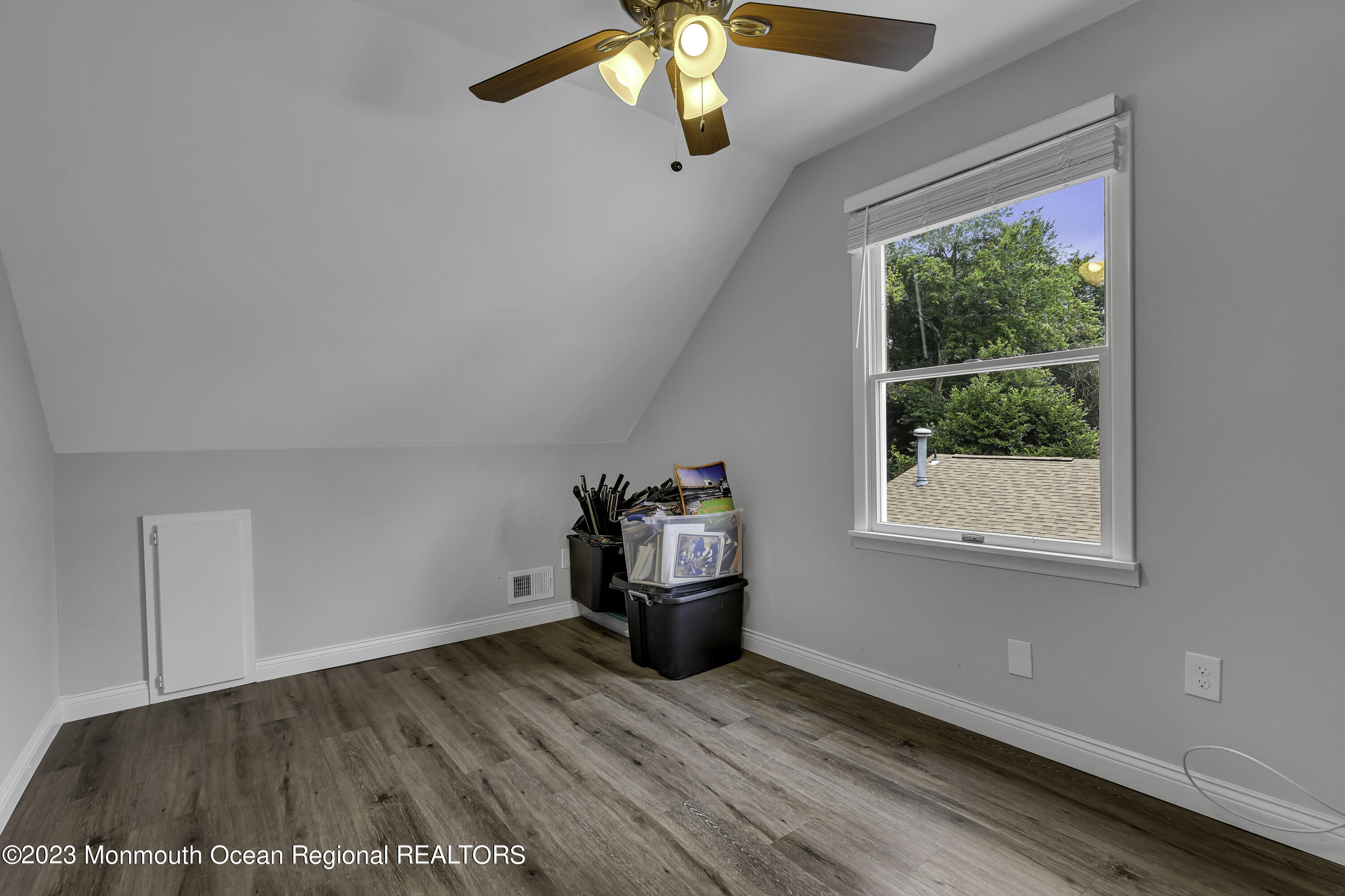 50 Central Avenue Waretown, NJ 08758 - Photo 27 of 35 a view of empty room with wooden floor and fan