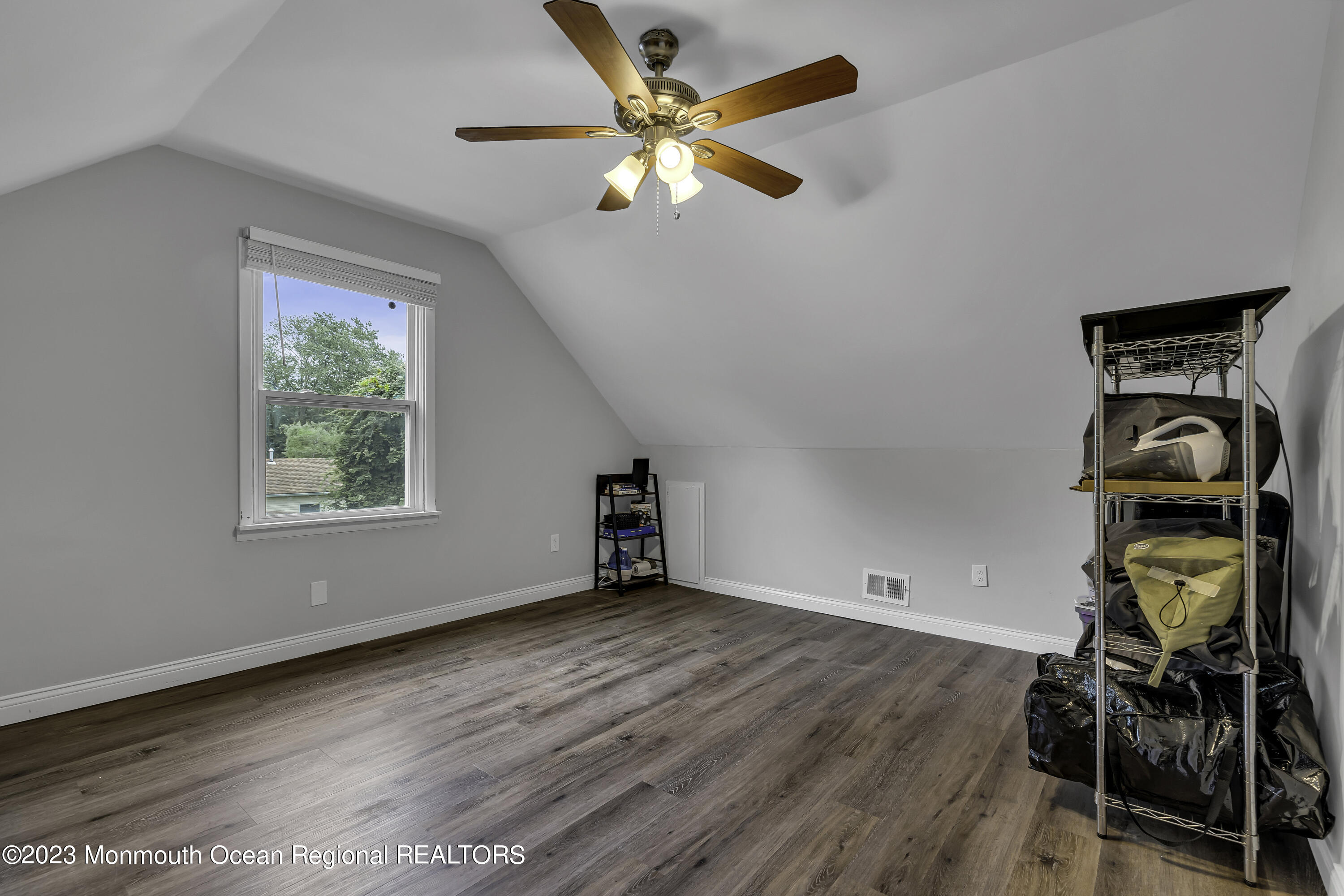 50 Central Avenue Waretown, NJ 08758 - Photo 29 of 35 a view of an empty room with window and wooden floor
