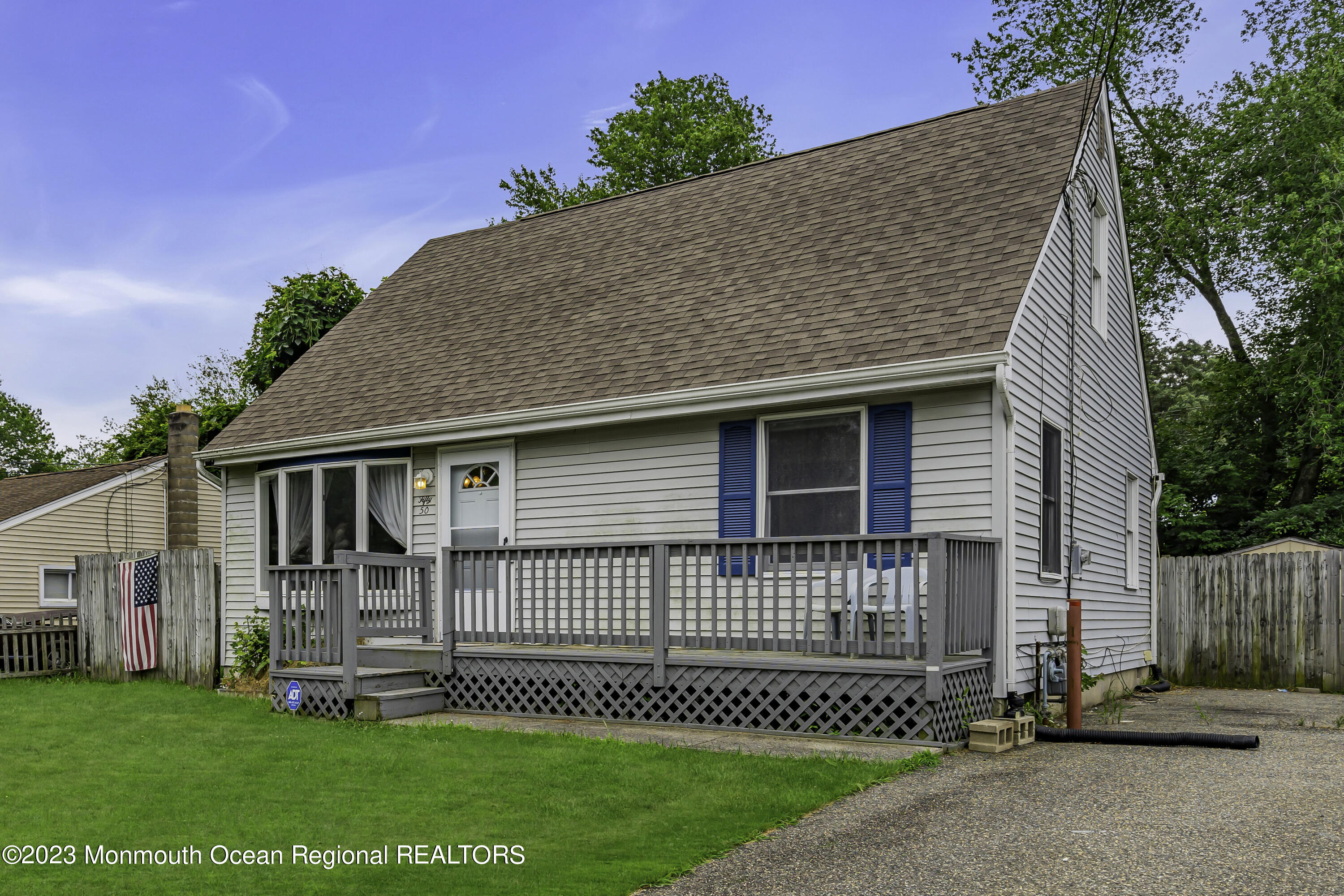 50 Central Avenue Waretown, NJ 08758 - Photo 3 of 35 a front view of a house with a garden