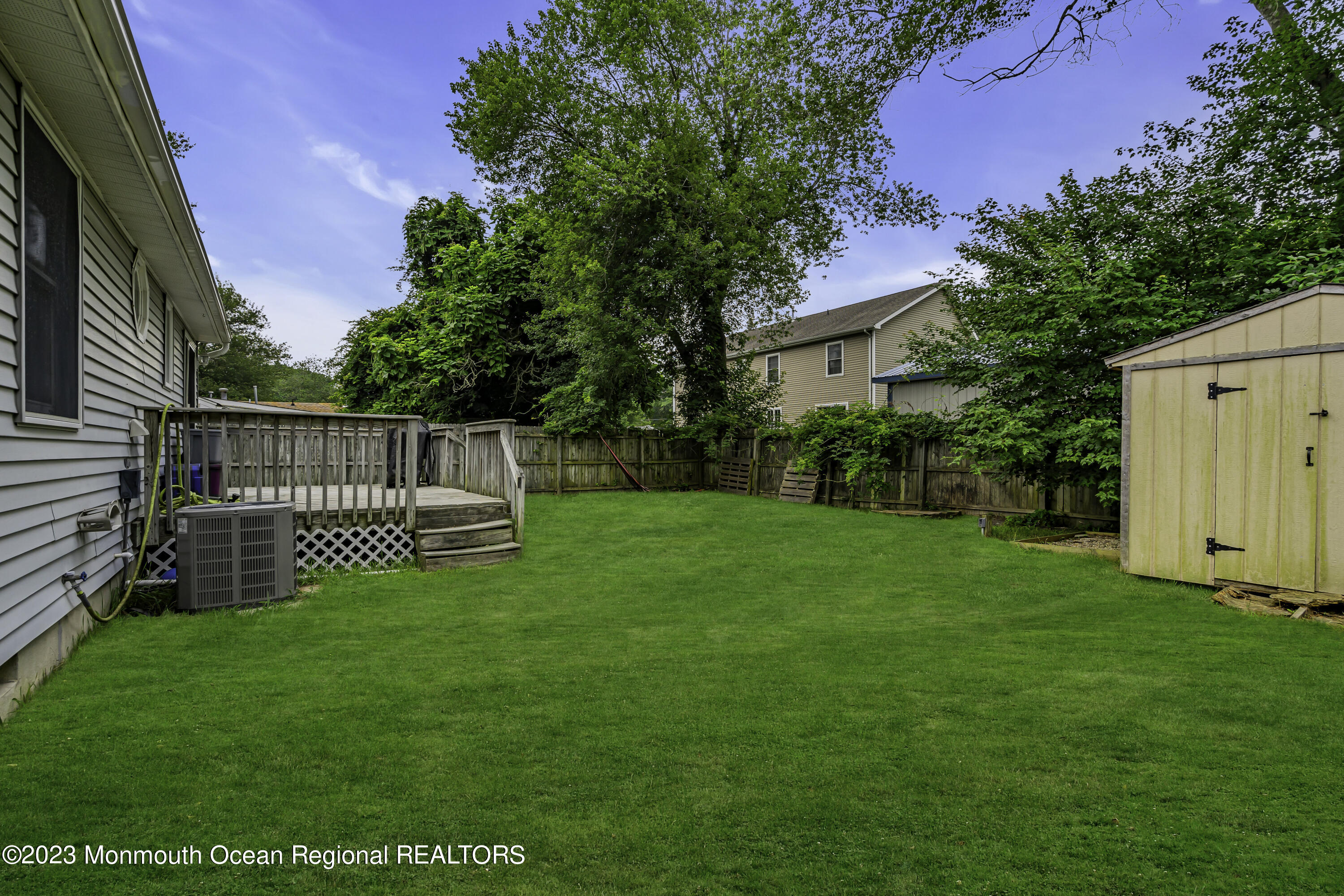 50 Central Avenue Waretown, NJ 08758 - Photo 32 of 35 a view of a house with a yard and a garden
