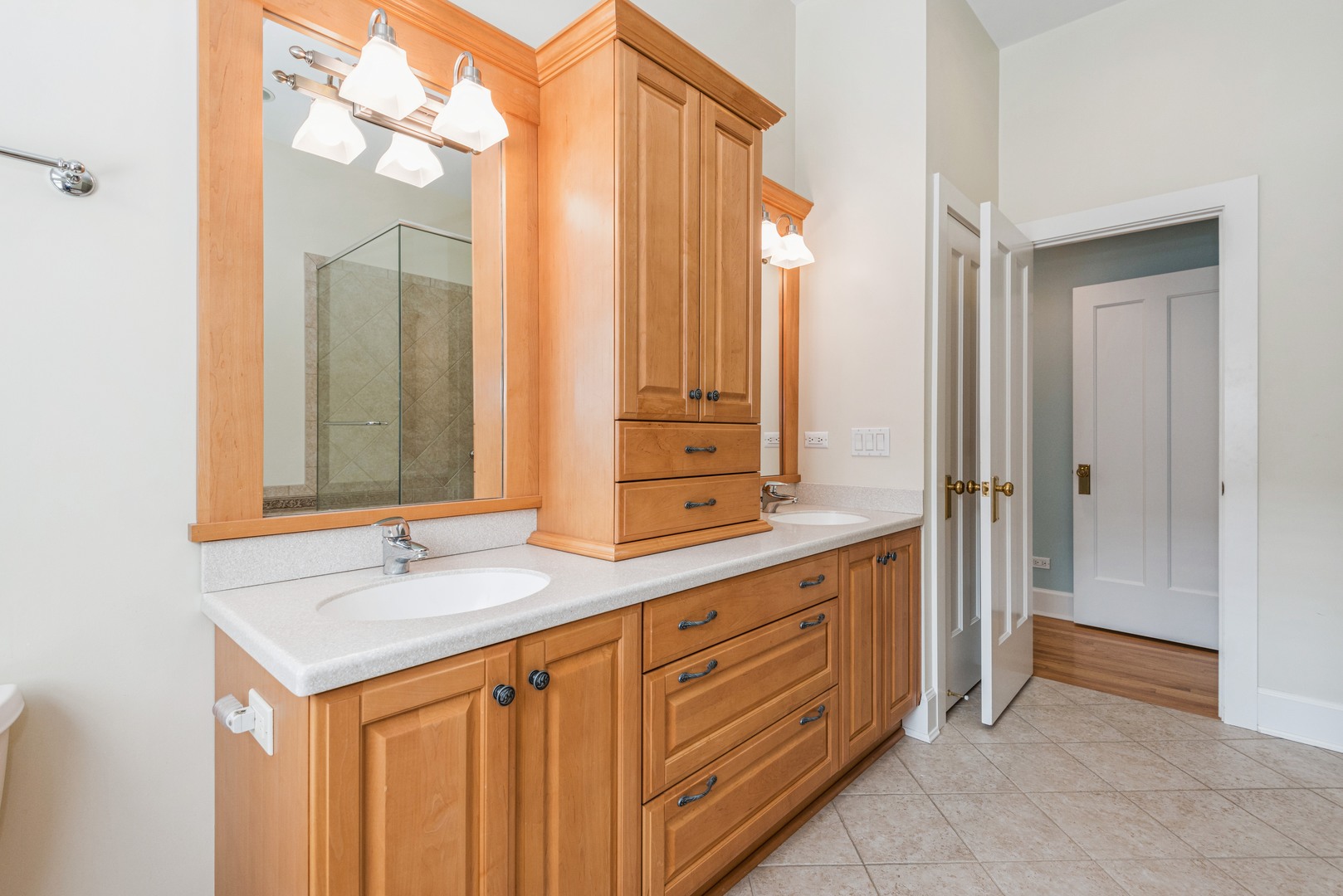 458 Sunset Road Winnetka, IL 60093 - Photo 12 of 17 a bathroom with a sink and a mirror