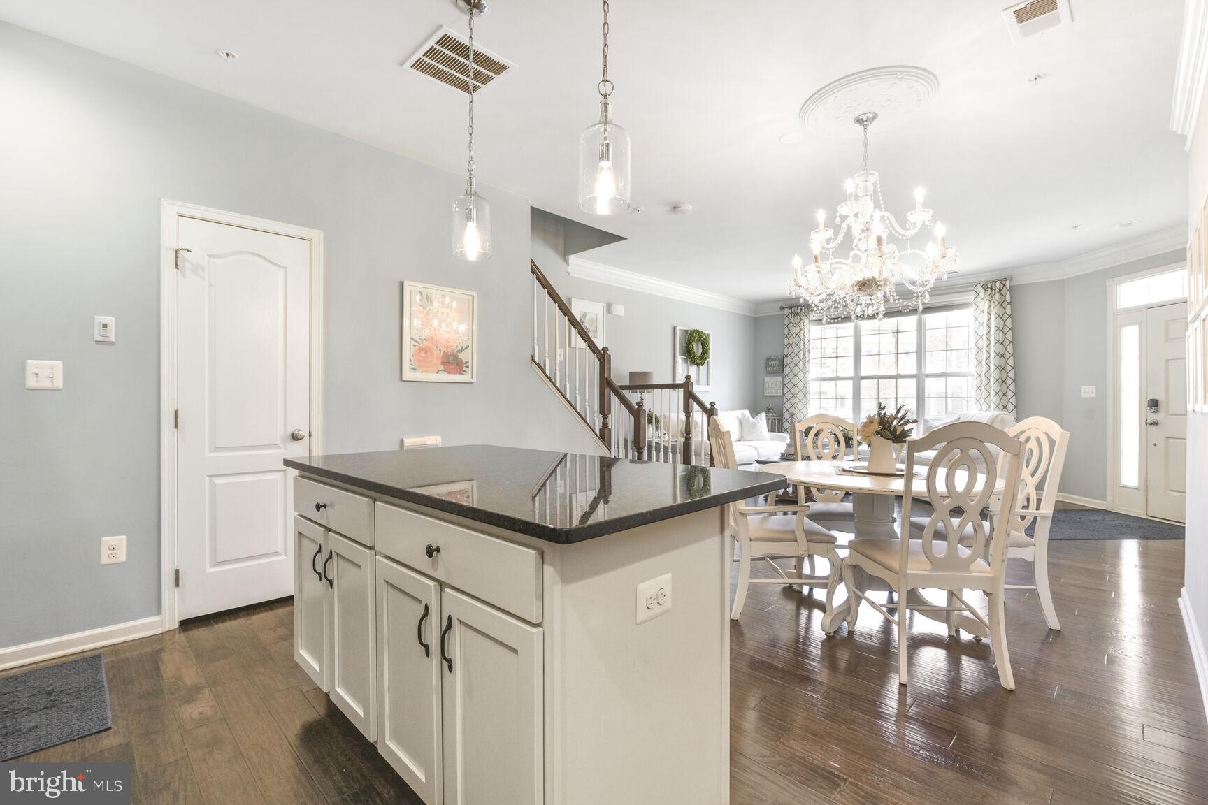 43037 Clarks Mill Terrace Ashburn, VA 20148 - Photo 14 of 28 a view of a dining room with furniture window and wooden floor
