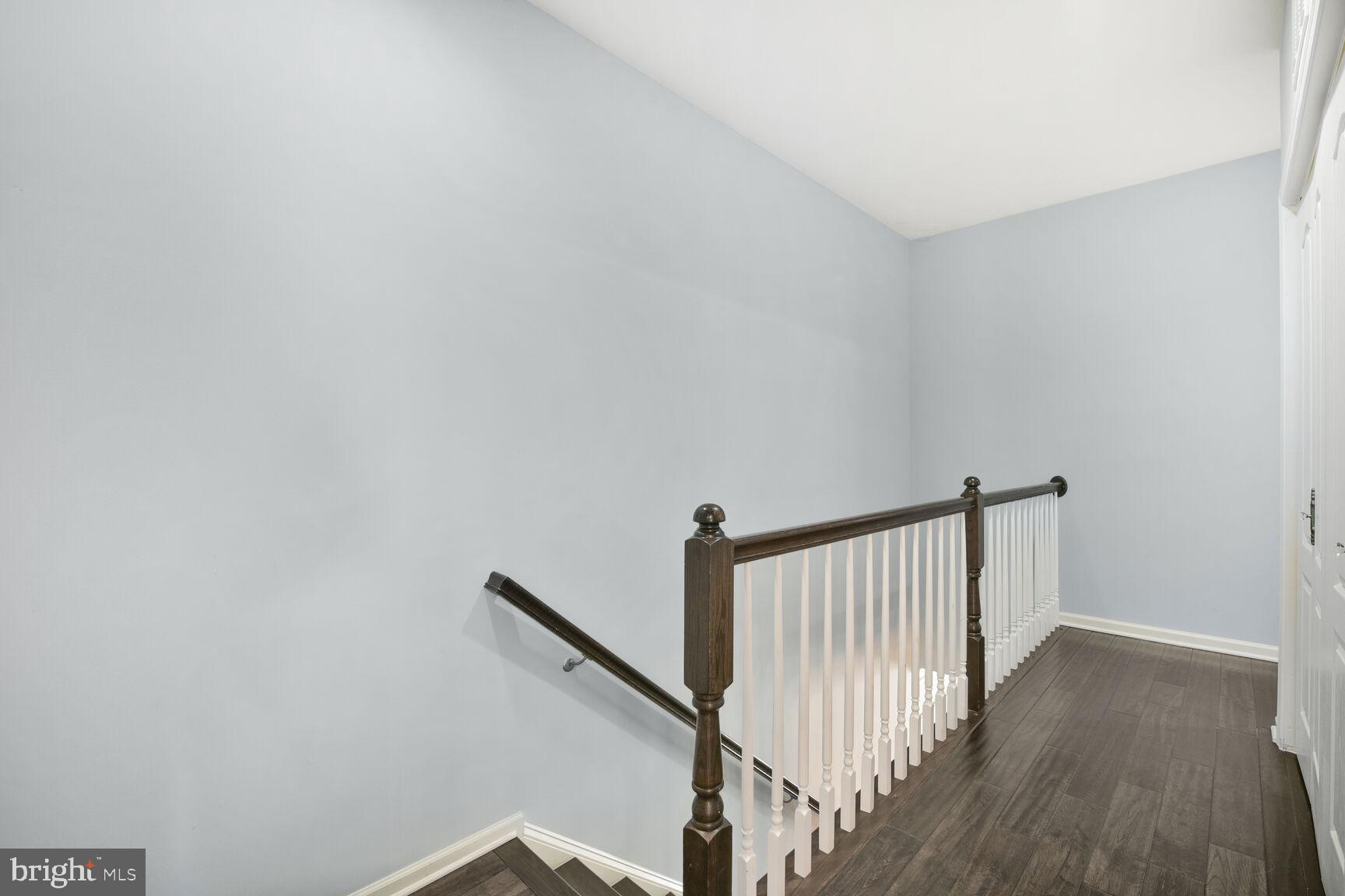 43037 Clarks Mill Terrace Ashburn, VA 20148 - Photo 18 of 28 a view of hallway with stairs