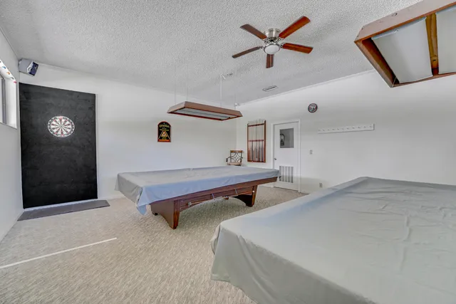 a backyard of a house with garden and trees