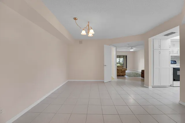 a kitchen with stainless steel appliances white cabinets and a sink