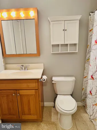 a bathroom with a toilet and a sink