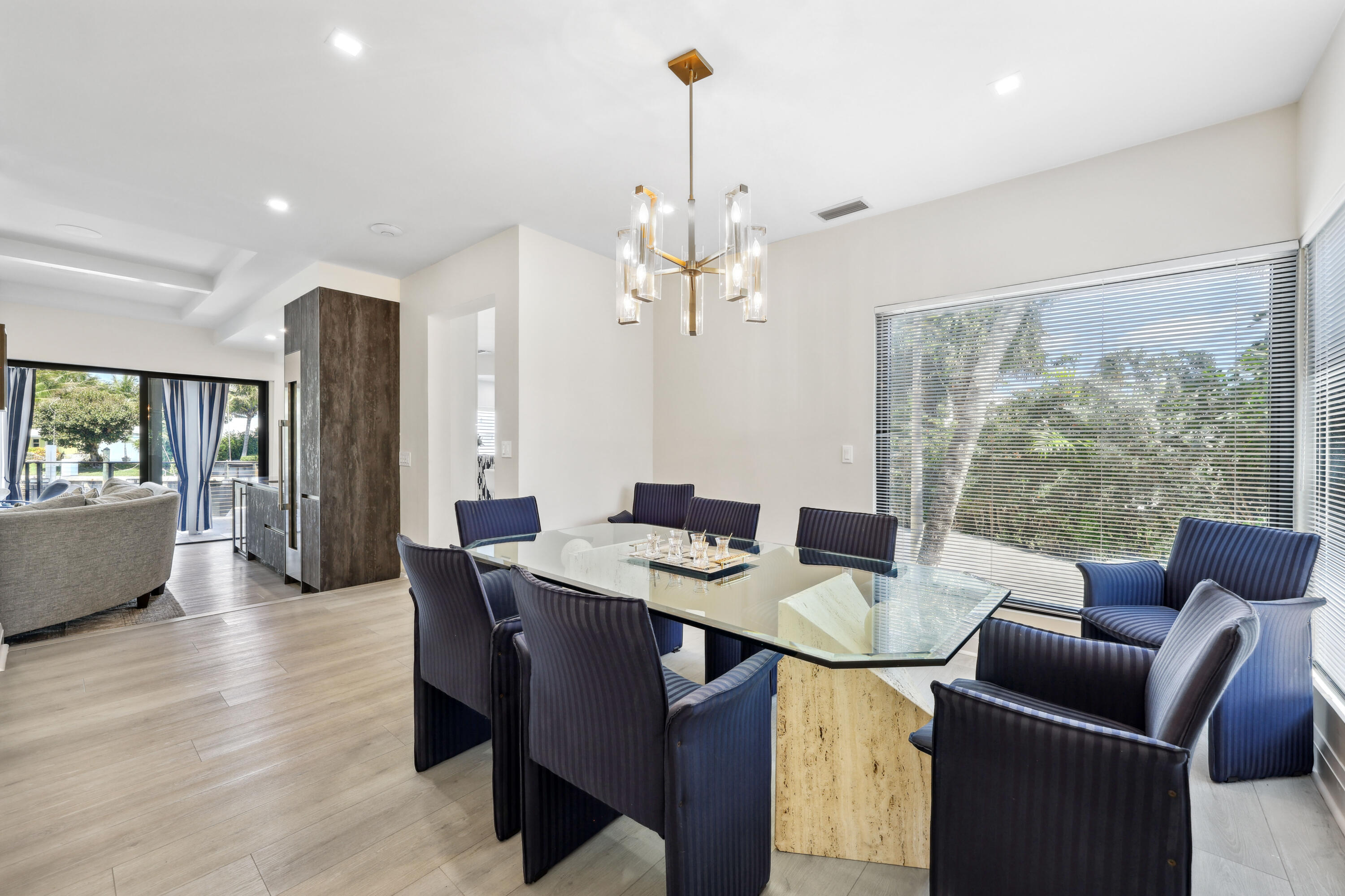 125 Marlin Drive Ocean Ridge, FL 33435 - Photo 15 of 122 a view of a dining room with furniture window and wooden floor