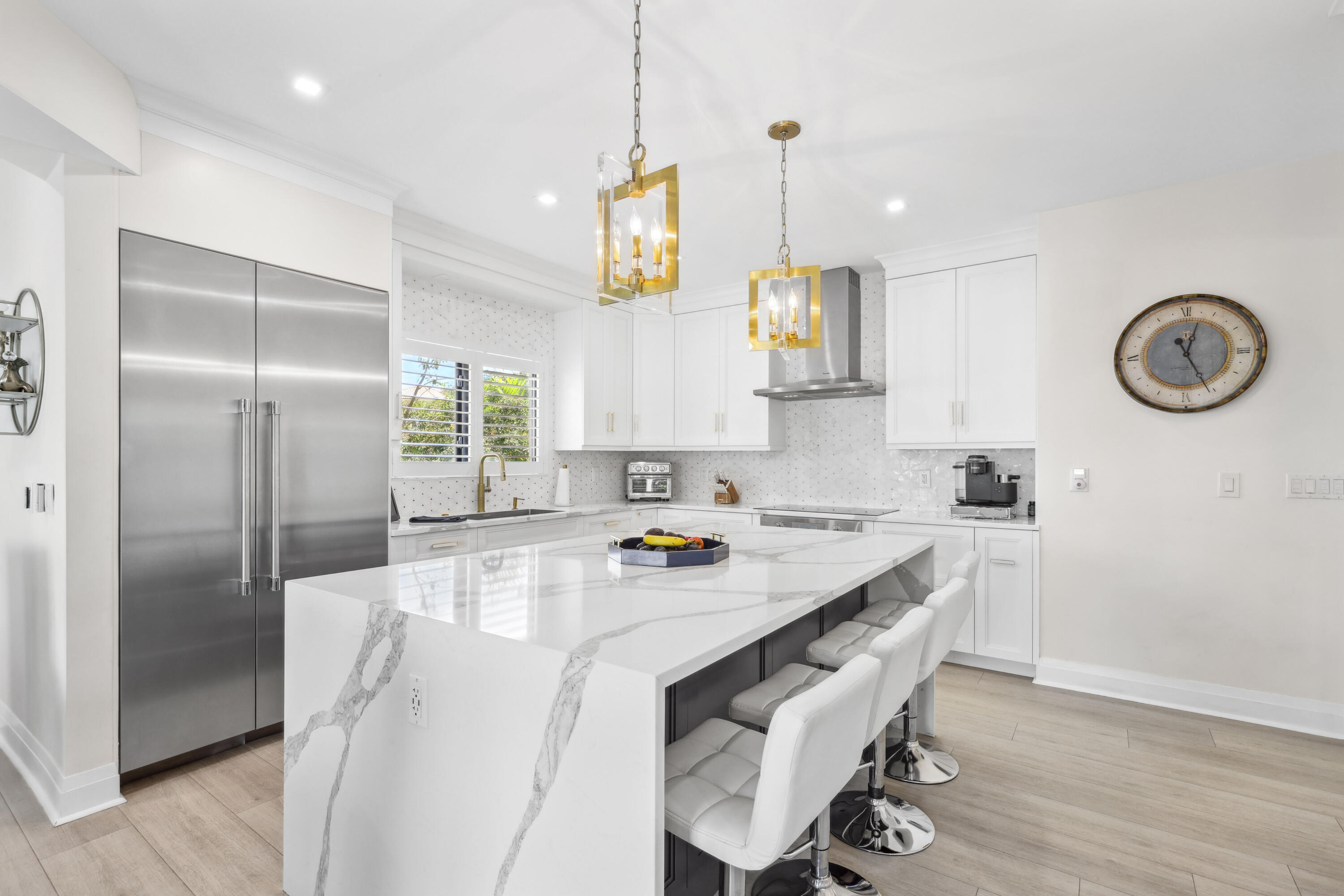 125 Marlin Drive Ocean Ridge, FL 33435 - Photo 16 of 122 a kitchen with stainless steel appliances granite countertop a sink a stove and a refrigerator