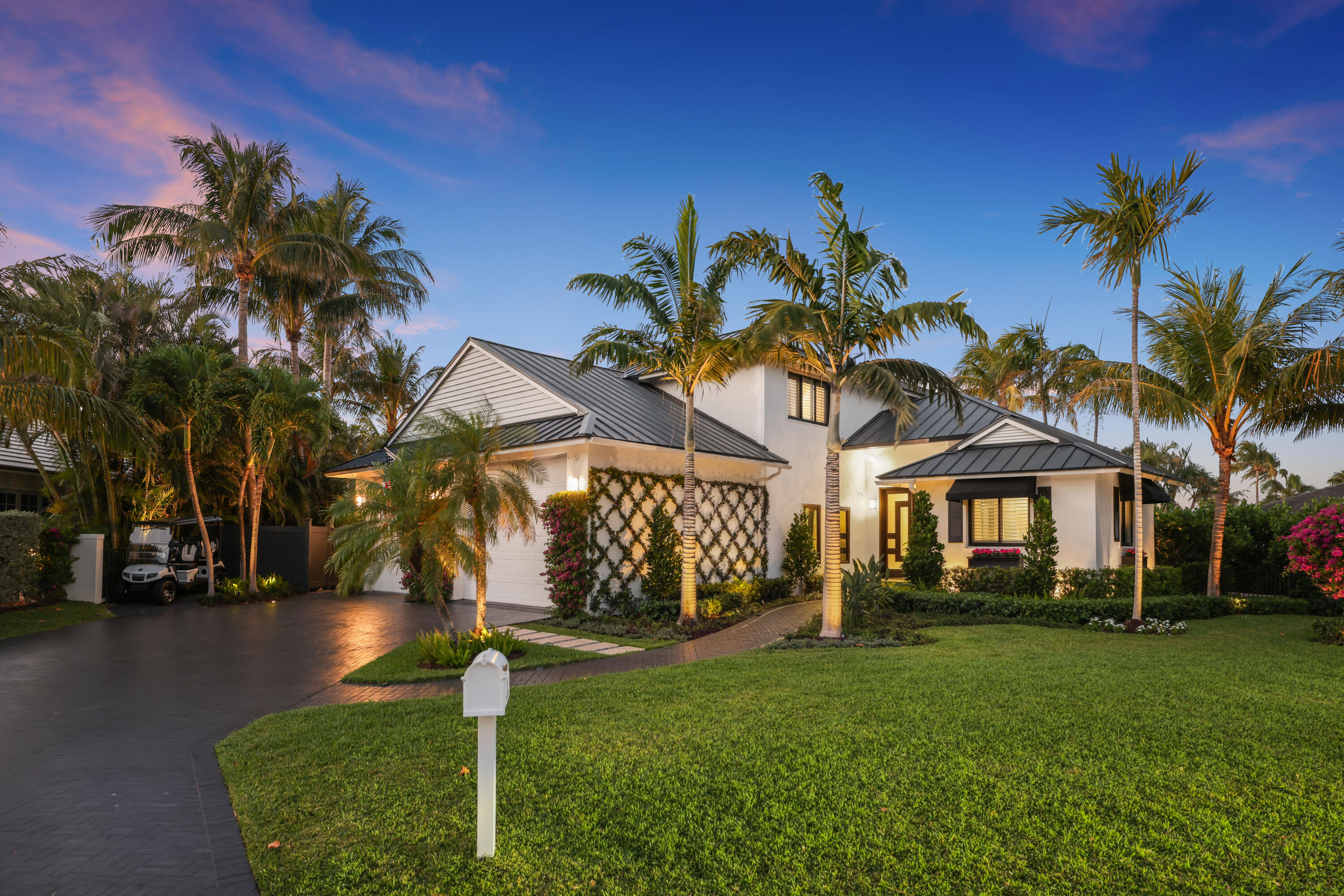 125 Marlin Drive Ocean Ridge, FL 33435 - Photo 2 of 122 a front view of a house with garden