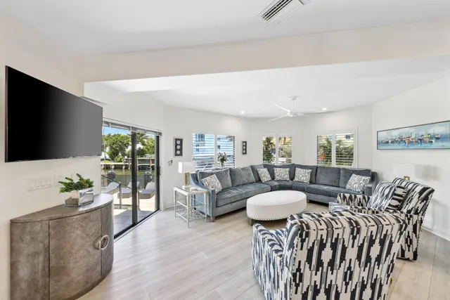 a media room with lots of chairs and a projector screen