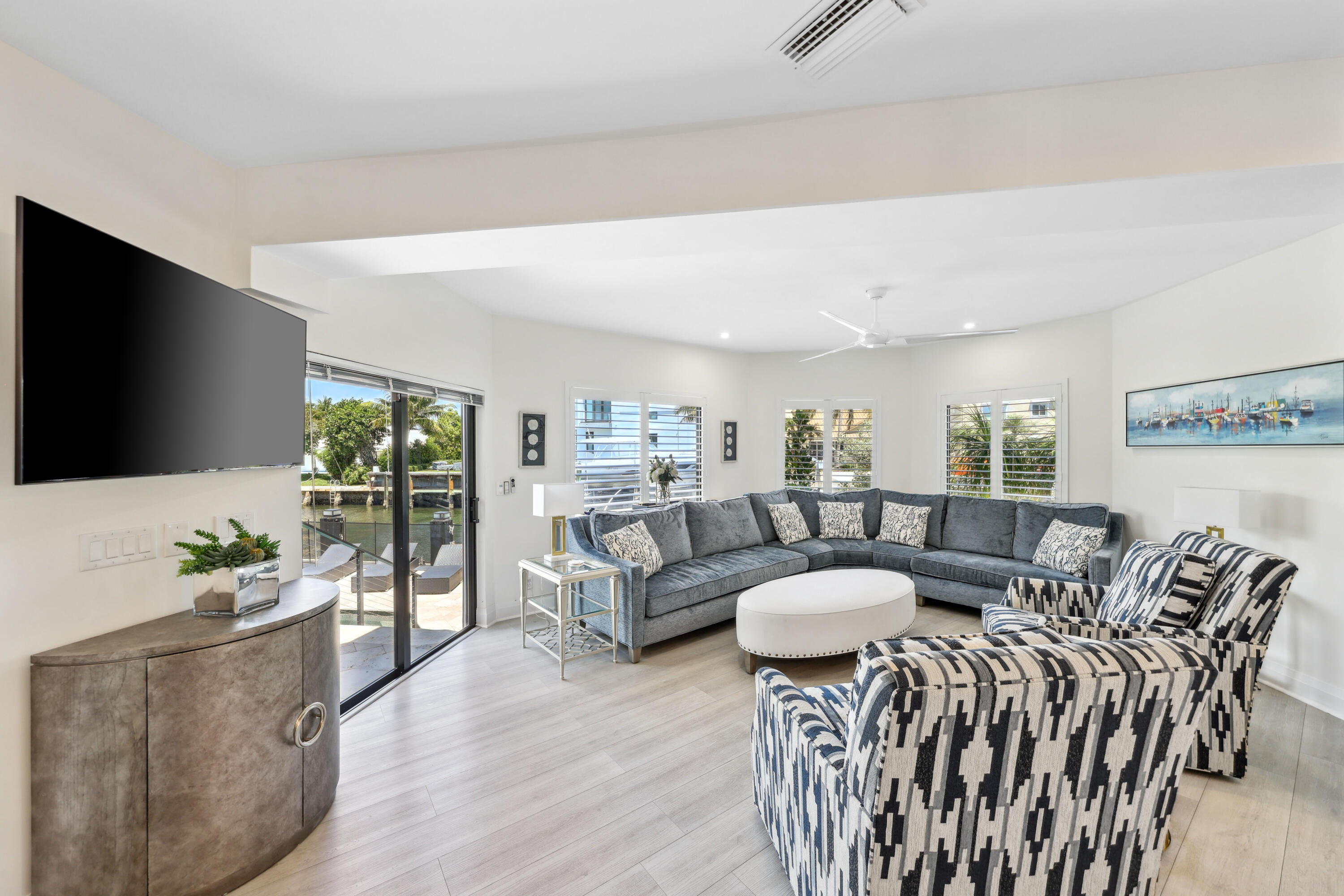 125 Marlin Drive Ocean Ridge, FL 33435 - Photo 27 of 122 a living room with furniture and a flat screen tv