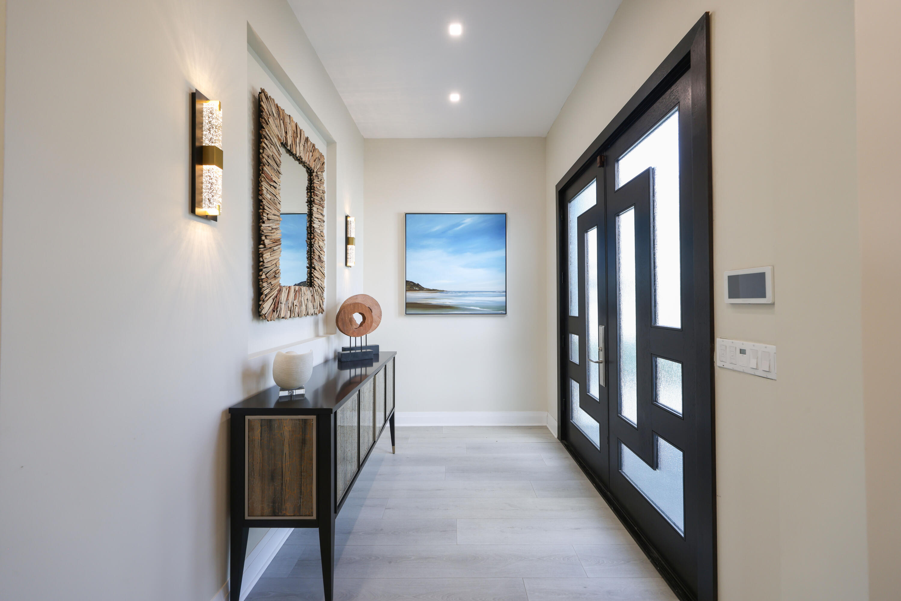 125 Marlin Drive Ocean Ridge, FL 33435 - Photo 4 of 122 a view of a hallway with paintings on the wall