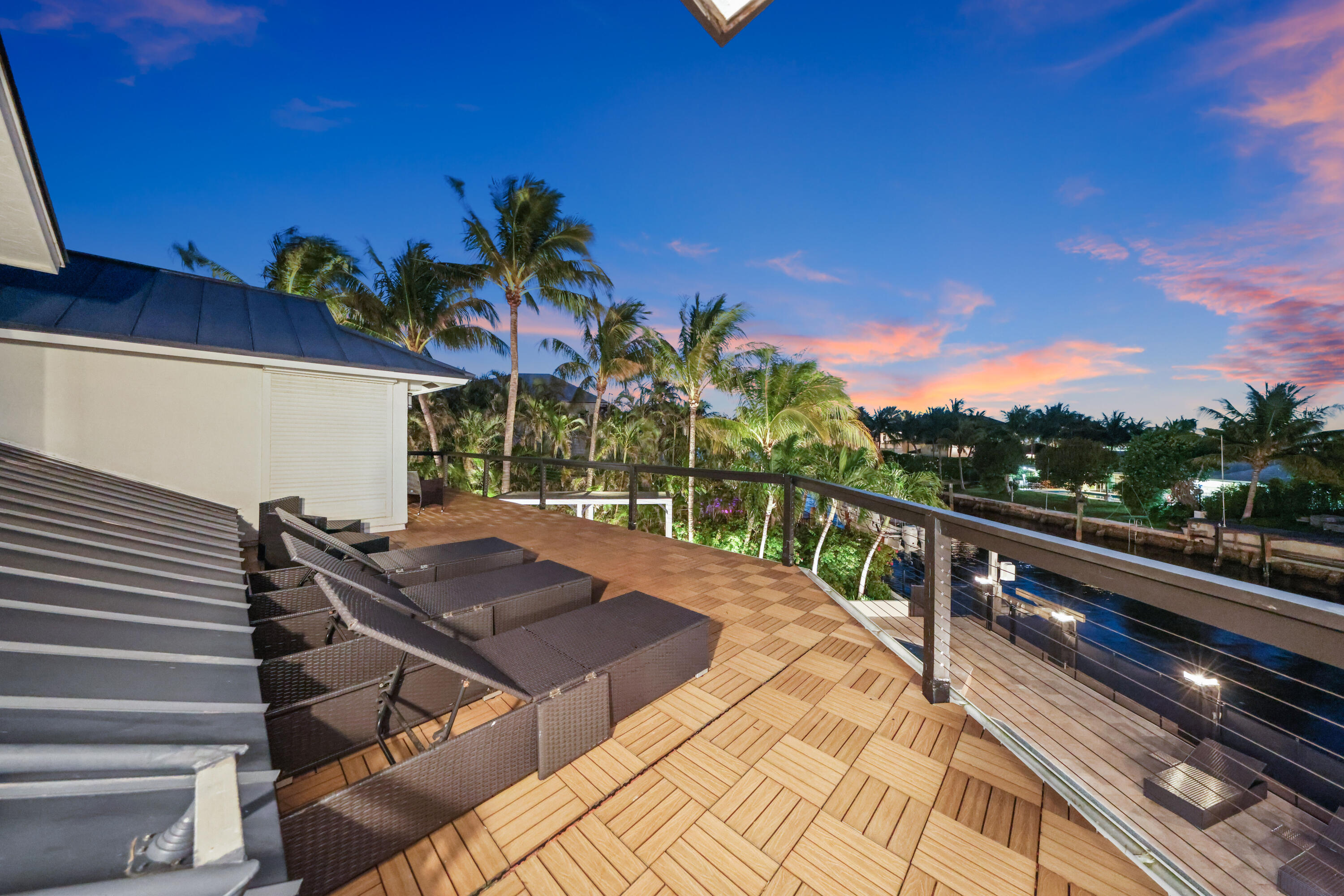 125 Marlin Drive Ocean Ridge, FL 33435 - Photo 44 of 122 a view of a balcony with wooden floor and potted plants