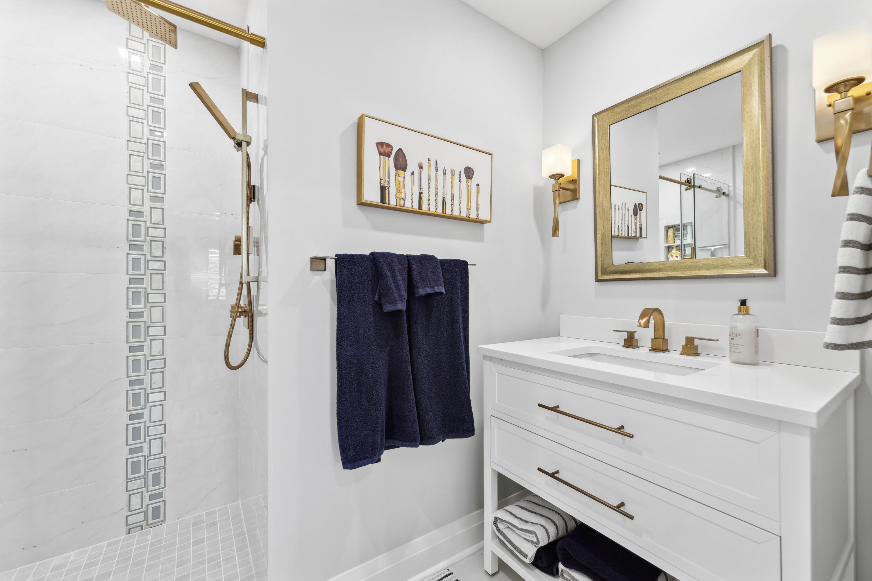 125 Marlin Drive Ocean Ridge, FL 33435 - Photo 47 of 122 a bathroom with a granite countertop sink a mirror a vanity and a shower