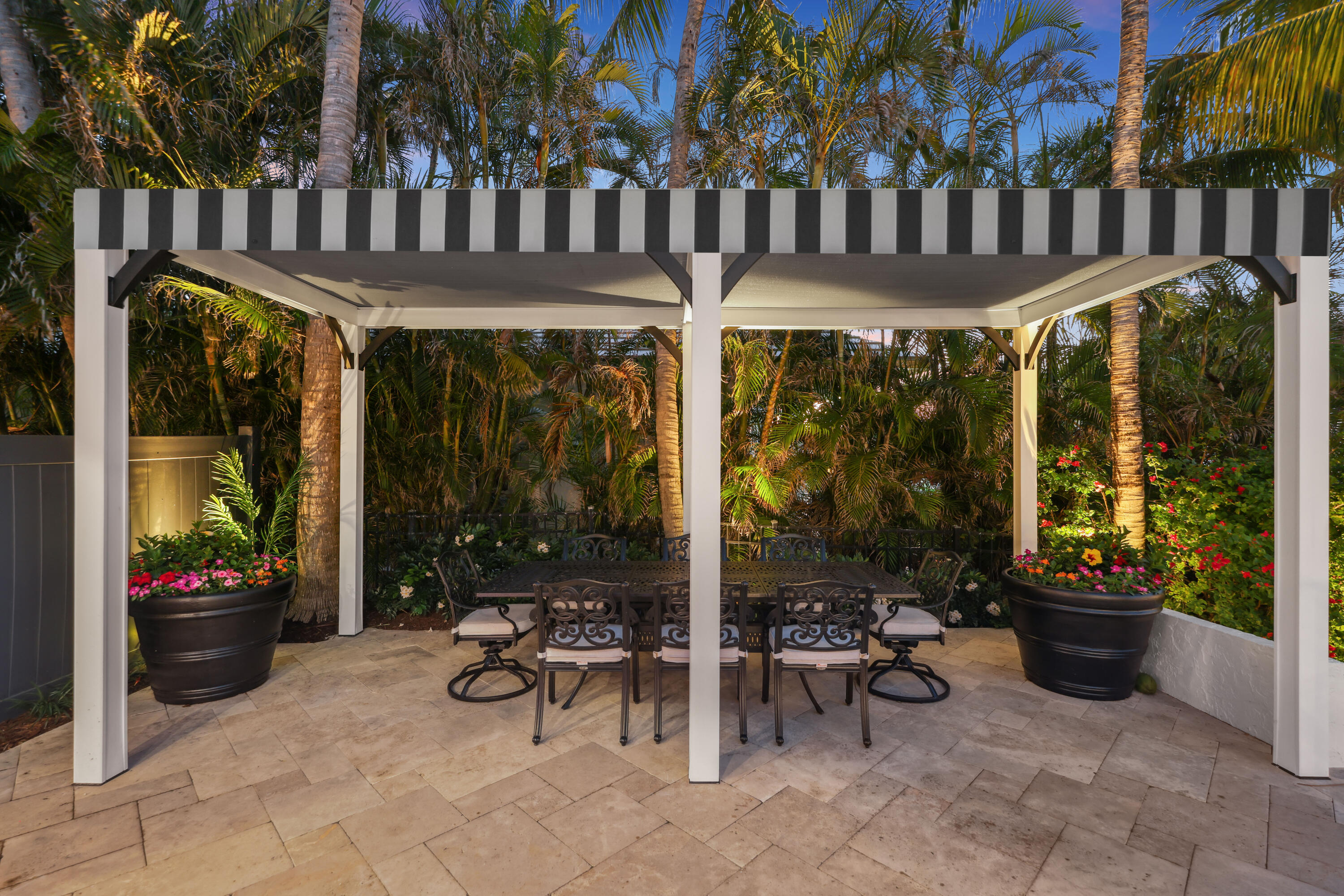 125 Marlin Drive Ocean Ridge, FL 33435 - Photo 71 of 122 a view of a patio with table and chairs and potted plants