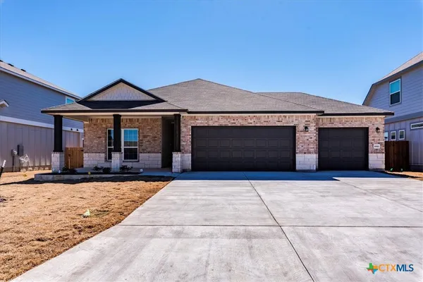 a front view of a house with yard