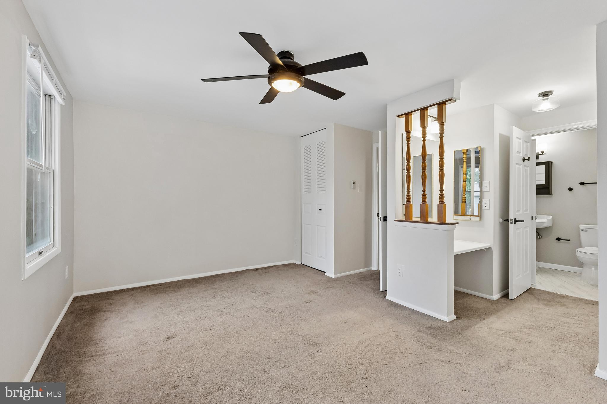 8317 Brookvale Court Springfield, VA 22153 - Photo 21 of 33 a view of an empty room with a ceiling fan